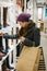 Woman in warm clothing shopping for shoes in a boutique shop