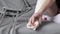 a woman warms up numb toes in plaster