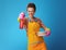 Woman with washed plates using dishwashing detergent as a gun