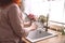 Woman washes beautiful dishes in a new sink on the kitchen in the morning