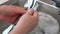 Woman washes the dishes by hands, hands closeup.