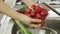 Woman washin vegetables