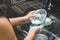 A woman washing bowl glass by dish soap make many bubble