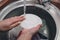 Woman washing dishes in kitchen sink, closeup view. Cleaning chores