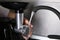 Woman washing electric meat grinder under tap water  indoors, closeup