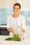 Woman washing fresh lettuce