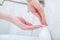 Woman washing hands with foam soap. Hygiene, preventing coronavirus