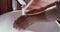 Woman washing hands with soap, close up view