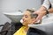 Woman washing head in hair salon