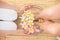 woman washing her feet in a bowl of flower