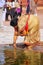 Woman washing in a pool in the courtyard of Jama Masjid in Fatehpur Sikri, Uttar Pradesh, India