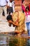 Woman washing in a pool in the courtyard of Jama Masjid in Fatehpur Sikri, Uttar Pradesh, India