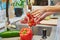 Woman washing tomato at kitchen sink