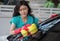 Woman washing windshield with sponge on car wash