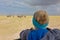 Woman watching herd of elephants on african wildlife safari. Amboseli, Kenya.