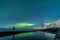 Woman watching the northern lights, Aurora Borealis, Devil Teeth mountains in the background, Tungeneset, Senja, Norway