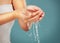 Woman, water drops and washing hands zoom, skincare isolated on studio background with skin, hygiene and hydration