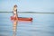 Woman in the water with paddleboard