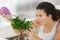 Woman watering bonsai