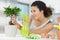 Woman watering bonsai