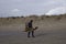 woman with waveboard walking at the beach