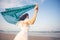 Woman with waver cloth on beach