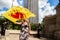 A Woman Waves a Flag with a Flaming Heart in Downtown Columbus