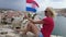 Woman waving a Croatian flag in Trogir