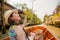 Woman waving goodbye at canal boat