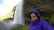 Woman Waving Hello By Majestic Waterfall Iceland - Girl Exercising In Summer