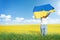 Woman waving national flag of Ukraine. Victory and independence day.