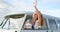 Woman waving out of camper van window 4k