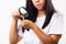 Woman weak hair problem her looking at destroyed hair with magnifying glass