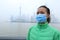 Woman wear a mask at the pollution city