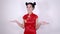 Woman wear red cheongsam with open hand palm in concept of chinese new year