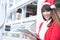 Woman wear santa hat holding tablet at her shop. asian female we