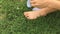 Woman wear socks on green grass background