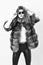 Woman wear sunglasses and hairstyle posing mink or sable fur coat. Fur fashion concept. Winter elite luxury clothes