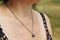 Woman wearing a Amethyst pendant