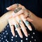 A woman wearing a beautiful finger ring jewelry.