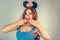 Woman wearing black mouse ears playing flirty