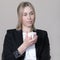 woman wearing business formal clothes holding cup of coffee and thinking. businesswoman employer having a break, hard