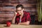 Woman Wearing Casual Red Shirt in Modern Office on Push-Button P