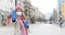 Woman wearing corona mask giving stop sign towards camera