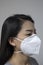 Woman wearing face mask of N95 because of air pollution in the city have particulate matters or PM 2.5.