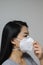 Woman wearing face mask of N95 because of air pollution in the city have particulate matters or PM 2.5.