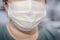 Woman wearing face mask protect filter against virus and air pollution pm2.5. Medical surgical flu illness protective mask texti