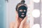 Woman wearing facial beauty mask. Concept of scincare and beauty tips at home