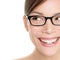 Woman wearing glasses looking happy to side