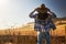 Woman wearing hat from behind looking at view of rural california landscape